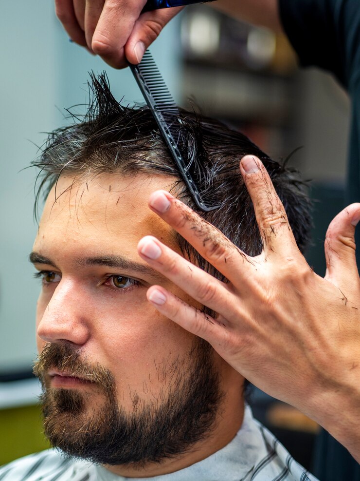 close up side view man getting professional haircut 23 2148256962